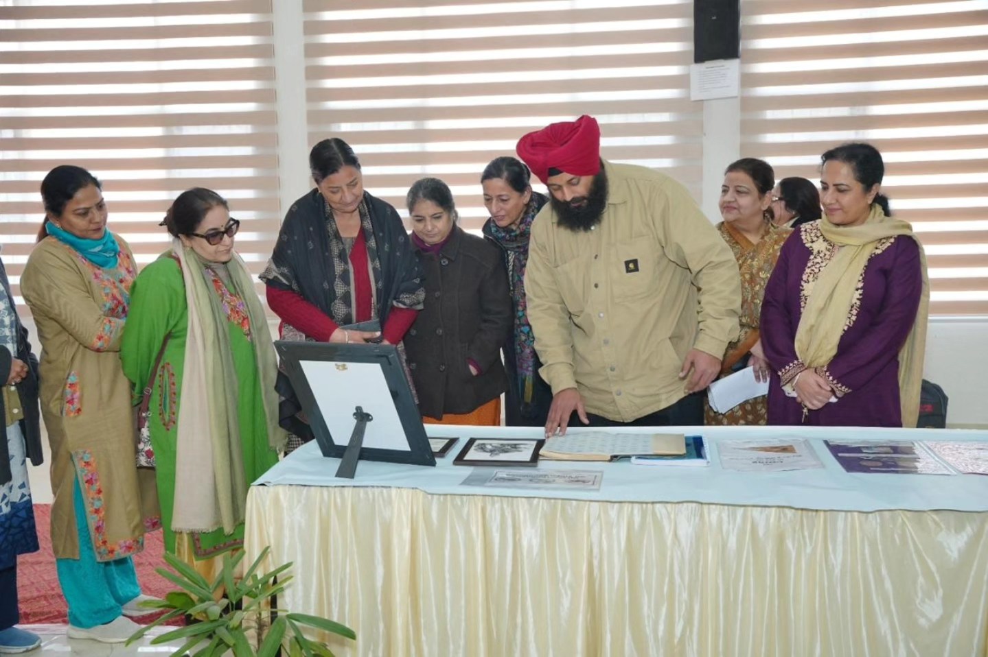 S. Davinder Singh highlights coins representing Sikh sovereignty and ideology.